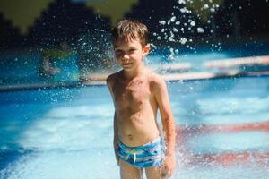 Boy having fun in aqua park photo