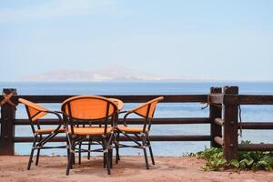 table in the restaurant on the sea background photo