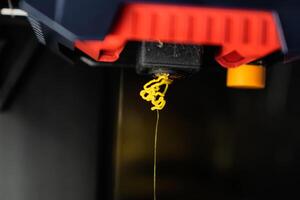 Extruder or 3d print head with pla filament, nozzle photo