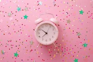 AI generated Alarm clock and confetti on pink background. Clock and party decorations. Generative AI photo