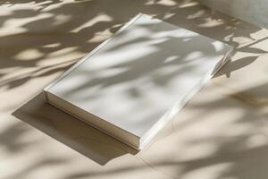 AI generated Mockup of a blank cover white book with a sunny background. Generative AI photo