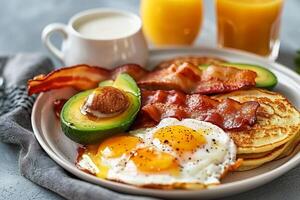 AI generated Breakfast set. Fried eggs, bacon, pancakes, avocado and orange juice. Generative AI photo