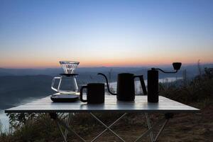 dipping coffee set on mountain background photo