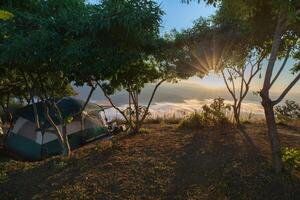 Camping tent  under clear sky photo