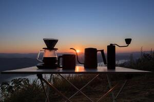 dipping coffee set on mountain background photo