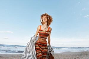 Sun-kissed Summer Bliss. Smiling Woman Enjoying Vacation Freedom on the Beach photo