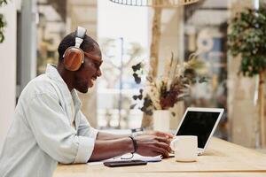 Lifestyle online men headphones working technology communication business sitting businessman photo