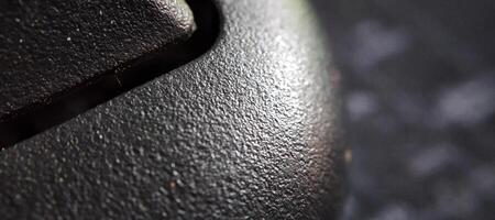 Macro shot of a black computer mouse, shallow depth of field photo