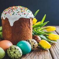 Easter egg panettone bread cake background Happy easter spring holiday tulip photo