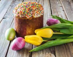 Easter egg panettone bread cake background Happy easter spring holiday tulip photo