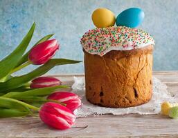 Easter egg panettone bread cake background Happy easter spring holiday tulip photo