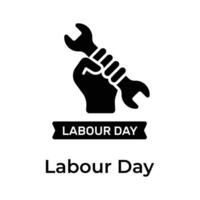 Hand holding spanner depicting concept icon of Labour Day in trendy style vector