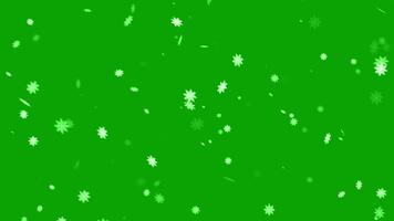sneeuwval bedekking Aan groen achtergrond. winter langzaam vallend sneeuw effect. 4k animatie. video