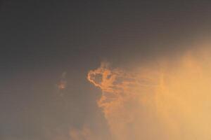 Abstract background of sunset sky with cloud. Amazing golden light in the evening. For background and textured. photo