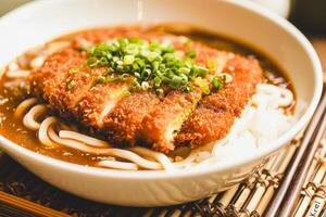 AI generated Crispy Chicken over Noodles with Scallions photo