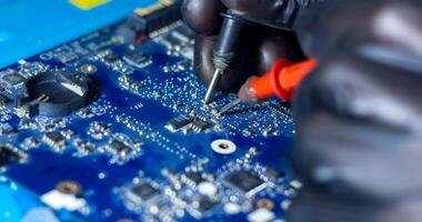 service worker repairing personal computer board photo