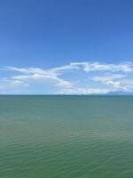 Clear Blue Sky Over Calm Sea photo