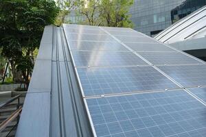 Roofs with solar panels on shopping center or office roofs photo