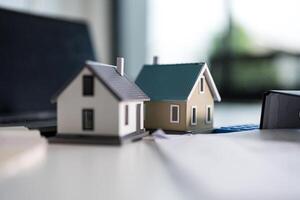 Real estate planning concept with miniature houses photo