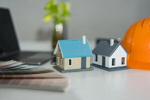 Real estate planning concept with miniature houses photo