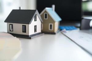 Real estate planning concept with miniature houses photo