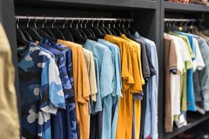 Assorted male clothing on shop rack photo