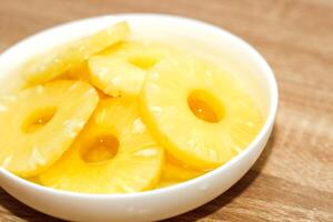 Pineapple rings canned in syrup close-up photo