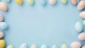 AI generated Easter Eggs Galore, Pastel-Colored Eggs Adorn the Top and Bottom, Creating a Festive Frame for a Large Empty Space, Set Against a Minimal Pastel Blue Background photo