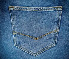 Blue jeans pocket. Jeans texture. Copy space. Selective focus. photo