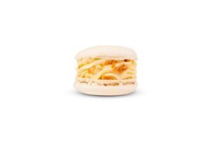 Macaron with caramel flavor isolated on a white background. Close-up. photo