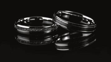 AI generated Two silver wedding rings on a black background. Close-up. photo