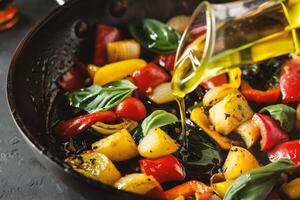 AI generated Roasted vegetables with olive oil in frying pan, closeup view photo