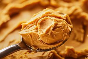 AI generated Creamy peanut butter on a spoon, close-up. photo