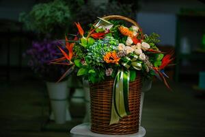 Colorful Flowers in Basket on Table photo