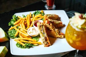 White Plate With French Fries and Sandwich photo