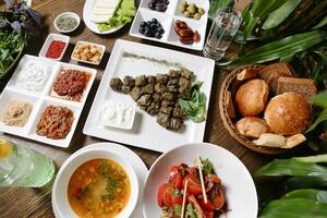 Wooden Table With Plates of Food photo