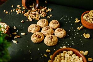 Abundance of Cookies and Nuts on Table photo