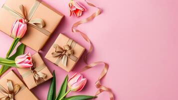 AI Generated Top view photo of trendy gift boxes with ribbon bows and tulips on isolated pastel pink background.