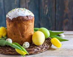 Easter egg panettone bread cake background Happy easter spring holiday tulip photo