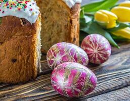 Easter egg panettone bread cake background Happy easter spring holiday tulip photo