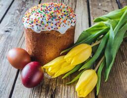 Easter egg panettone bread cake background Happy easter spring holiday tulip photo