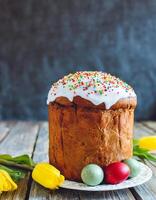 Easter egg panettone bread cake background Happy easter spring holiday tulip photo