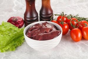 Raw turkey liver in a bowl ready for cooking photo