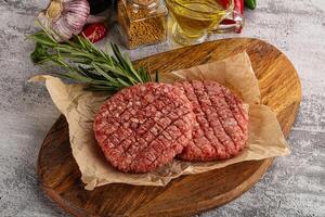 Raw burger cutlet for grill photo