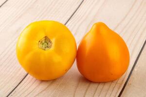 Ripe yellow bright juicy tomato photo