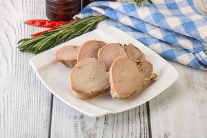 Baked pork tenderloin served rosemary photo