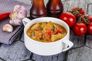 Traditional yellow Thai curry with chicken photo