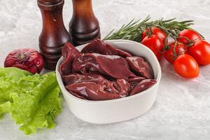 Raw turkey liver in a bowl ready for cooking photo