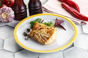 Roasted cod fish steak with salad photo