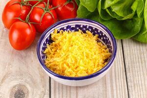 Shredded cheese in the bowl photo